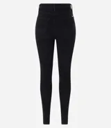 Pantalón skinny de terciopelo cotelê color marrón, con cintura mediana, bolsillos delanteros y traseros, cierre por botón y cremallera.