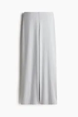 Pantalón largo de punto suave color gris melange, de tiro alto, corte amplio y cintura elástica.