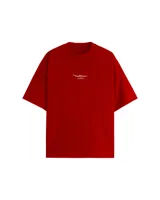 Remera negra de corte holgado con efecto desgastado y estampado de graffiti en la espalda.