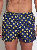 Bóxer de algodón con estampado floral en tonos azul y blanco, con cintura elástica y logo de la marca en el centro.