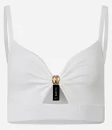 Top super cropped color crudo, de punto, con escote en V, breteles finos y adorno de nudo con aro dorado en el busto.