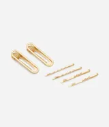 Set de seis pinzas para el pelo doradas, que incluye dos pinzas grandes con forma ovalada y cuatro pinzas pequeñas con diseño ondulado.