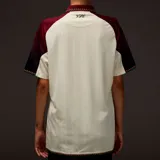 Camiseta de fútbol Nike Nocta del Venezia, modelo Away. Diseño blanco con mangas en degradé de bordó a negro y detalles en naranja y verde. Incluye logo de Nocta, escudo del club y la palabra "Venezia" estampada en el frente.