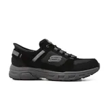 Championes Skechers Hands Free Slip-ins Relaxed Fit: Oak Canyon Consistent Winner para hombre, color negro con detalles en gris. Capellada de gamuza, material sintético y malla, con cordones elásticos. Plantilla Skechers Air-Cooled Memory Foam y suela flexible de alta tracción.