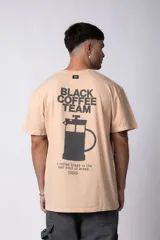 Remera color durazno de algodón lavado con estampa frontal con la frase "Coffee Break is the best kind of break".