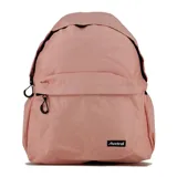 Mochila escolar color rosa pálido, con diseño clásico de tapa superior y bolsillo frontal horizontal con cierre. Presenta tiradores de cremallera negros y un parche con el logo "Austral" en la parte inferior frontal.