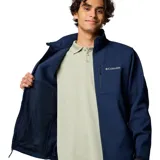 Chaqueta Columbia Ascender Soft Shell para hombre, color azul marino. Cuenta con tejido resistente al agua y al viento, protector de mentón, bolsillo en el pecho con cierre, bolsillos para manos con cierre, puños ajustables y dobladillo ajustable con ceñidor.