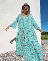 Vestido túnica largo color celeste con estampado de motivos geométricos en color ladrillo.