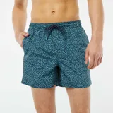 Short de baño azul con estampado de lunares blancos y cordón ajustable en la cintura.