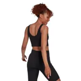 Top deportivo Adidas negro, de corte cropped y tejido acanalado.