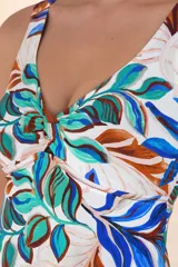 Top de traje de baño tipo tankini con estampado botánico en tonos blanco, azul, turquesa y marrón. Presenta escote en V con nudo central y breteles anchos ajustables.