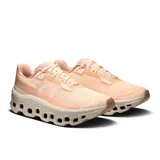 Championes de running On Cloudmonster Void, color salmón con suela blanca y tecnología CloudTec.