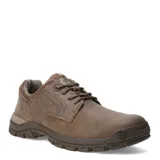 Zapato de hombre Caterpillar modelo Threshold Low en color marrón, con diseño de caña baja, cierre de cordones y suela de goma con tracción.