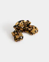 Broche para el pelo con diseño de moño color rojo.