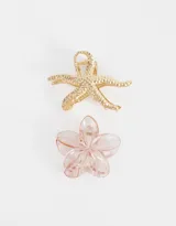 Set de dos broches para el pelo con forma de estrella de mar dorada y flor rosa.