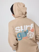 Canguro beige con capucha, estampado frontal con el texto "Australian Surfgirl Rusty" y un hibisco blanco.