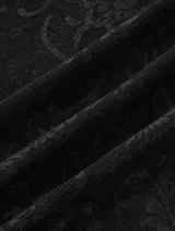 Pantalón de encaje negro con cintura elástica y corte acampanado.