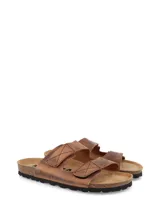 Sandalias de cuero 100%, con ajuste de velcro, diseño orgánico y base de plantilla en corcho.