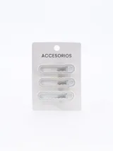 Set de tres pinzas para el pelo color blanco con diseño ondulado.