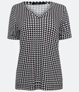 Blusa de viscolycra con estampado pied de poule en blanco y negro, cuello redondo y mangas cortas.