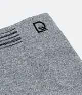 Calzoncillo bóxer blanco de poliamida, con cintura elástica a rayas grises y logo de la marca.