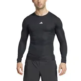 Remera de compresión Adidas Techfit de manga larga, color negro con logo blanco en el pecho.