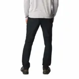 Pantalón de trekking color marrón claro, con protección solar UPF 50, repelente al agua y a las manchas. Cuenta con rodillas articuladas, puños cónicos, bolsillos con cremallera y detalles reflectantes.