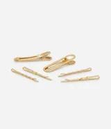Set de seis pinzas para el pelo doradas, que incluye dos pinzas grandes con forma ovalada y cuatro pinzas pequeñas con diseño ondulado.