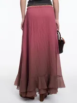 Falda larga color beige con degradé a verde oliva, cintura elástica y volado en el ruedo.