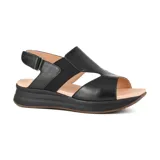 Sandalias negras de cuero sintético con plataforma y ajuste con hebilla.