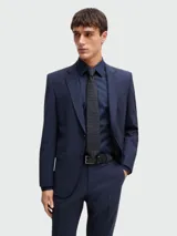 Corbata negra con micro estampado geométrico en celeste.