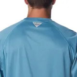 Remera de manga larga Columbia Terminal Tackle Heat, color gris jaspeado, con logo de la marca en el pecho y en la manga. Confeccionada en tejido transpirable de secado rápido y protección solar UPF 50.
