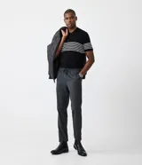 Polo de hombre slim fit, confeccionada en viscosa y poliamida, color negro con rayas horizontales blancas, cuello tradicional con botones y mangas cortas.