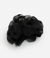 Pinza para el pelo negra con revestimiento de tela de poliéster con estampado de lunares.