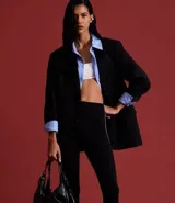 Pantalón legging negro de rib con cintura elástica y piecito.