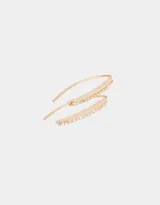 Aros colgantes largos de metal dorado con strass.