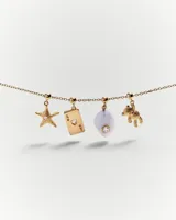 Dije colgante de ágata azul con circonita blanca engarzada en oro amarillo.