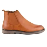 Bota Chelsea de cuero negro con elásticos laterales y tirador trasero.