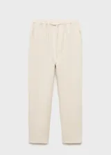 Pantalón de lino color beige, de corte recto, con cintura elástica ajustable con cordón.