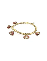 Pulsera dorada con cadena de eslabones y cinco dijes colgantes de mariquitas con cristales rojos y negros.