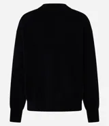 Buzo suéter femenino de tricot color verde esmeralda, con cuello redondo y puños ajustados. Confeccionado con viscosa certificada, poliéster y poliamida.