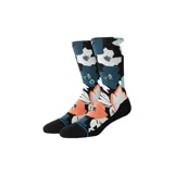 Medias Stance con estampado de flores en tonos naranja, blanco, azul y celeste sobre fondo negro.
