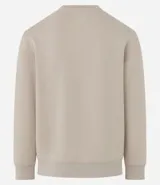 Buzo deportivo color verde claro, de manga larga y cuello redondo. Confeccionado en tejido de poliéster, viscosa y elastano.