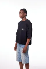Remerón negro de algodón con cuello redondo y logo estampado en serigrafía.