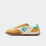 Championes Converse Run Star Trainer color crema, con detalles en amarillo y verde agua.