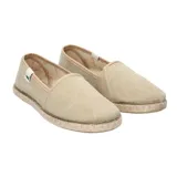 Alpargatas color ocre con suela de yute y goma.