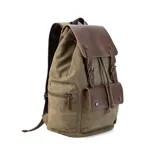 Mochila negra de tela canvas con detalles en símil cuero marrón, cierre superior marinero, bolsillos internos y externos con cierre metálico, asas rígidas y correas ajustables.