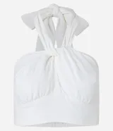 Blusa cropped blanca con lazo en el cuello, busto cruzado y lastex en la espalda.