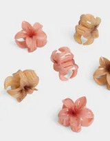 Set de seis broches pequeños con forma de flor hawaiana en colores rosa y marrón.