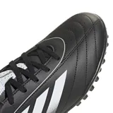 Championes de fútbol Adidas Goletto IX para pasto sintético, color negro con detalles en blanco. Exterior sintético suave con acolchado y perforaciones. Suela de caucho con taches. Ajuste clásico y cierre de cordones.